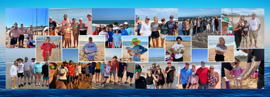 Happy clients on Florida beach holding fish caught during guided surf fishing trip